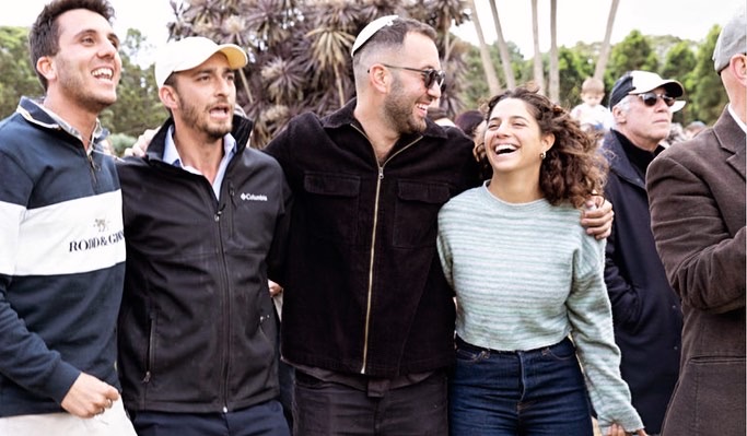 Friends laughing together at a community gathering