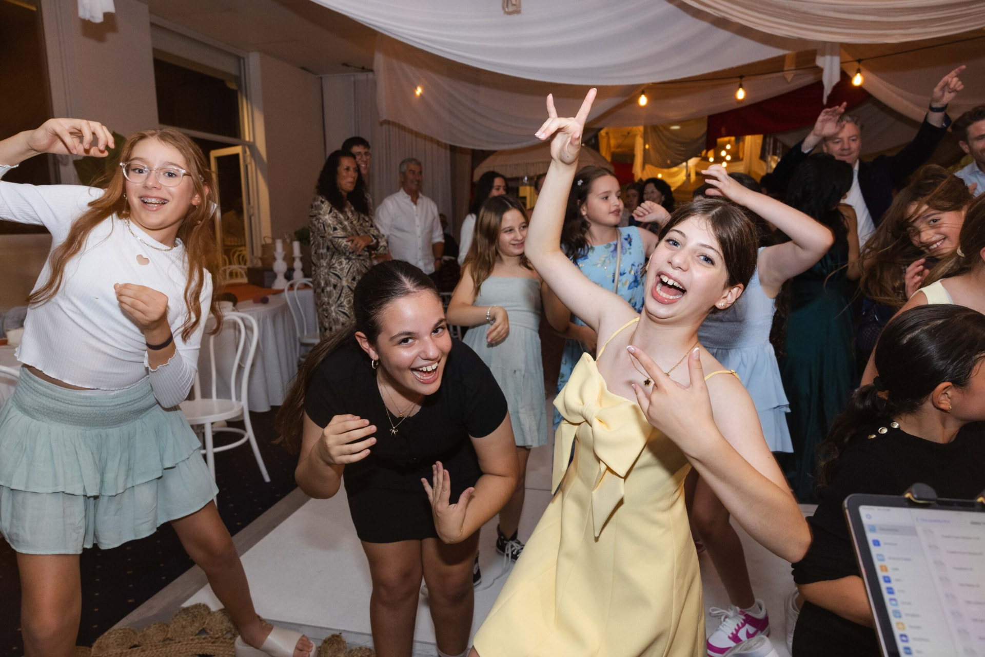 Young guests dancing and laughing at a Bat Mitzvah celebration